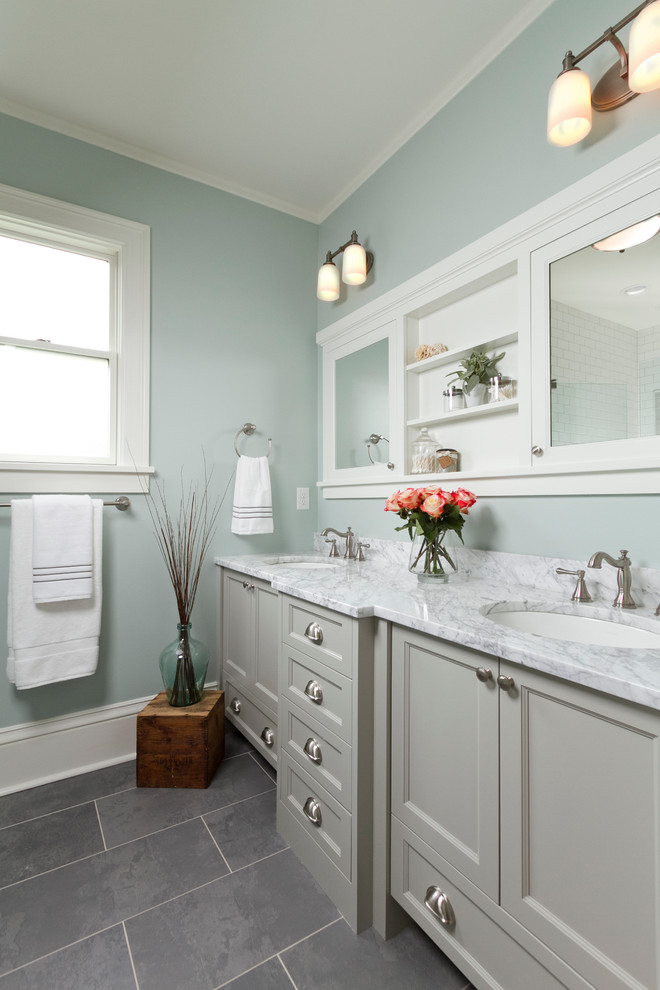 Medium sized traditional ensuite bathroom in Minneapolis with a submerged sink, grey cabinets, marble worktops, a two-piece toilet, black tiles, stone tiles, blue walls, ceramic flooring and recessed-panel cabinets.