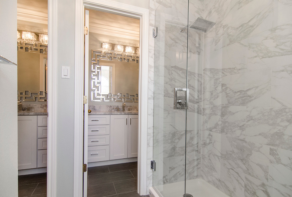 Example of a mid-sized transitional kids' gray tile and ceramic tile porcelain tile bathroom design in Dallas with an undermount sink, shaker cabinets, white cabinets, granite countertops, a two-piece toilet and gray walls