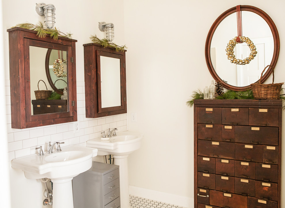 Inspiration for a rustic bathroom remodel in Columbus with a pedestal sink