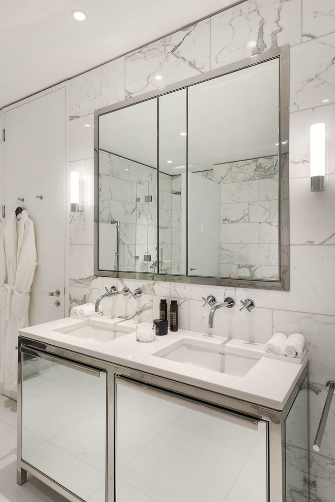 Photo of a contemporary ensuite bathroom in London with flat-panel cabinets, white tiles, white walls and a submerged sink.