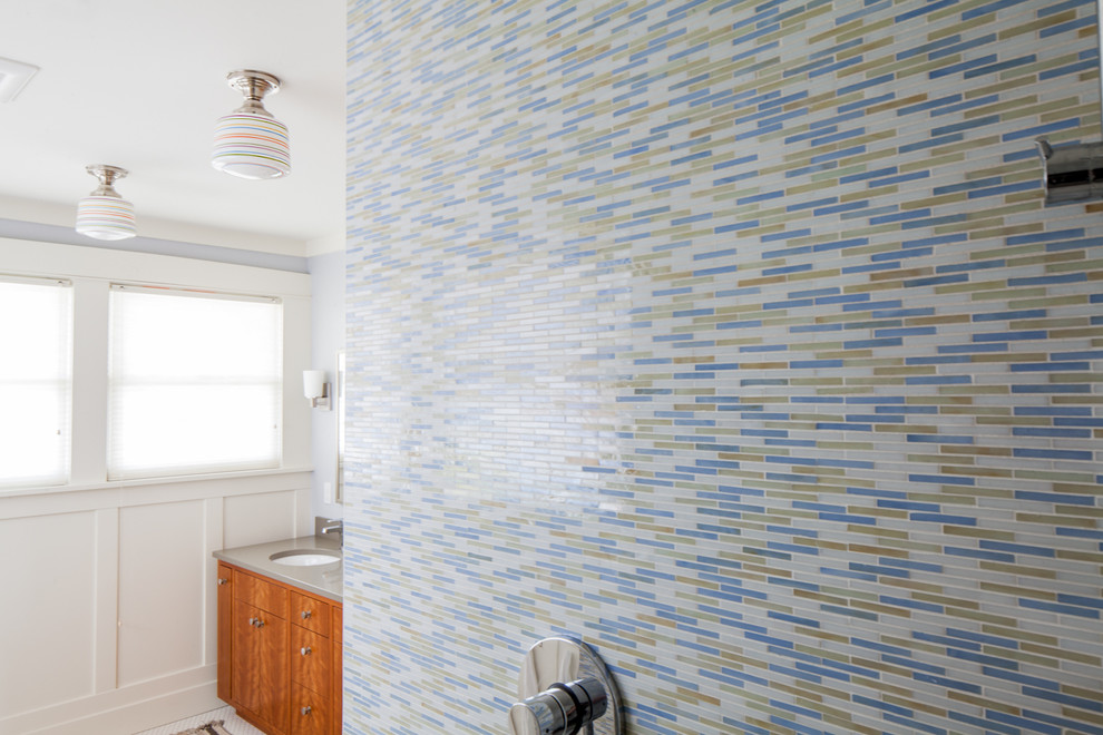 Doorless shower - transitional kids' multicolored tile porcelain tile doorless shower idea in Portland with an undermount sink, medium tone wood cabinets, quartz countertops, blue walls and flat-panel cabinets