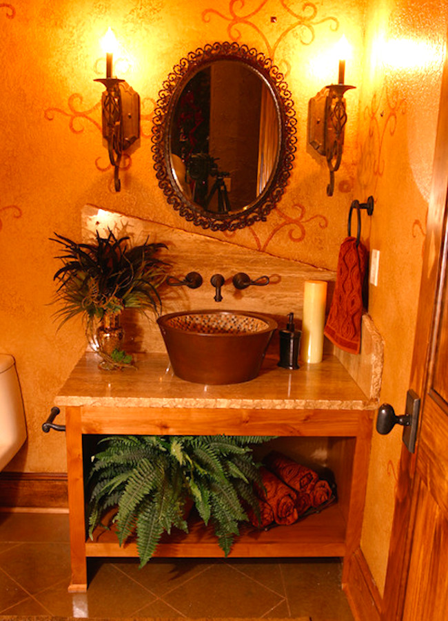Ispirazione per una piccola stanza da bagno tropicale con lavabo a bacinella, ante con riquadro incassato, ante beige, piastrelle nere, piastrelle in ceramica, pareti gialle e pavimento con piastrelle a mosaico