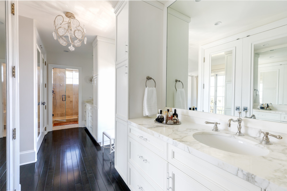 Bathroom - transitional master dark wood floor, brown floor and double-sink bathroom idea in Los Angeles with recessed-panel cabinets, white cabinets, gray walls, an undermount sink, white countertops and a built-in vanity
