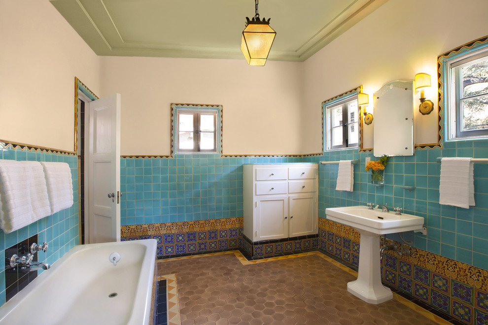 Tuscan mosaic tile bathroom photo in Los Angeles with a pedestal sink
