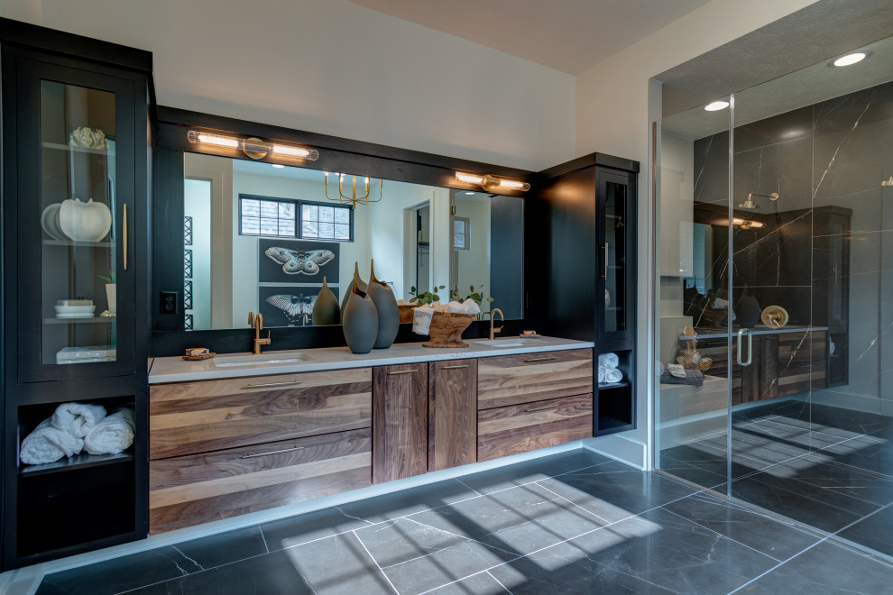 Photo of a large contemporary bathroom in Indianapolis with shaker cabinets, dark wood cabinets, a freestanding bath, a two-piece toilet, black and white tiles, ceramic tiles, white walls, ceramic flooring, a built-in sink, engineered stone worktops, black floors, a hinged door, grey worktops, double sinks and a floating vanity unit.