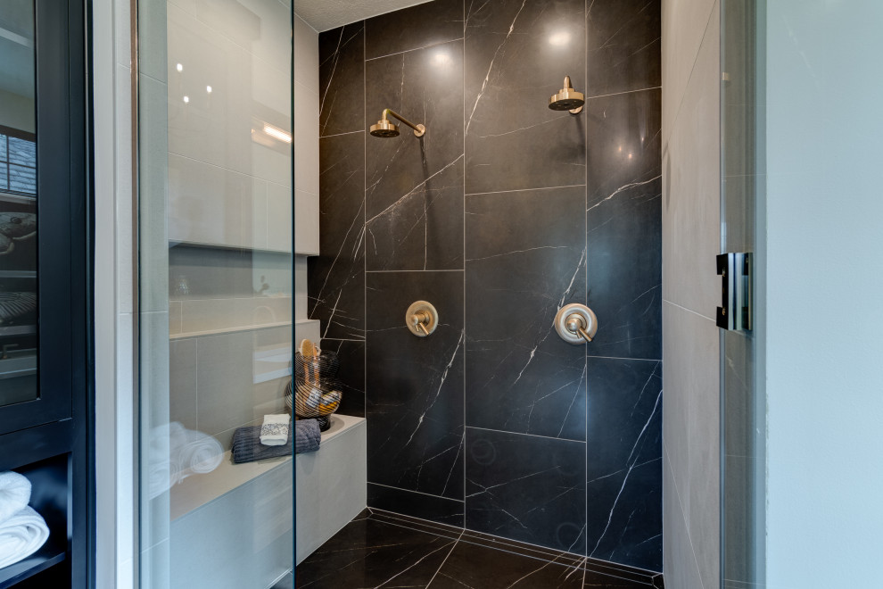 Inspiration for a large contemporary bathroom in Indianapolis with shaker cabinets, dark wood cabinets, a freestanding bath, a two-piece toilet, black and white tiles, ceramic tiles, white walls, ceramic flooring, a built-in sink, engineered stone worktops, black floors, a hinged door, grey worktops, double sinks and a floating vanity unit.
