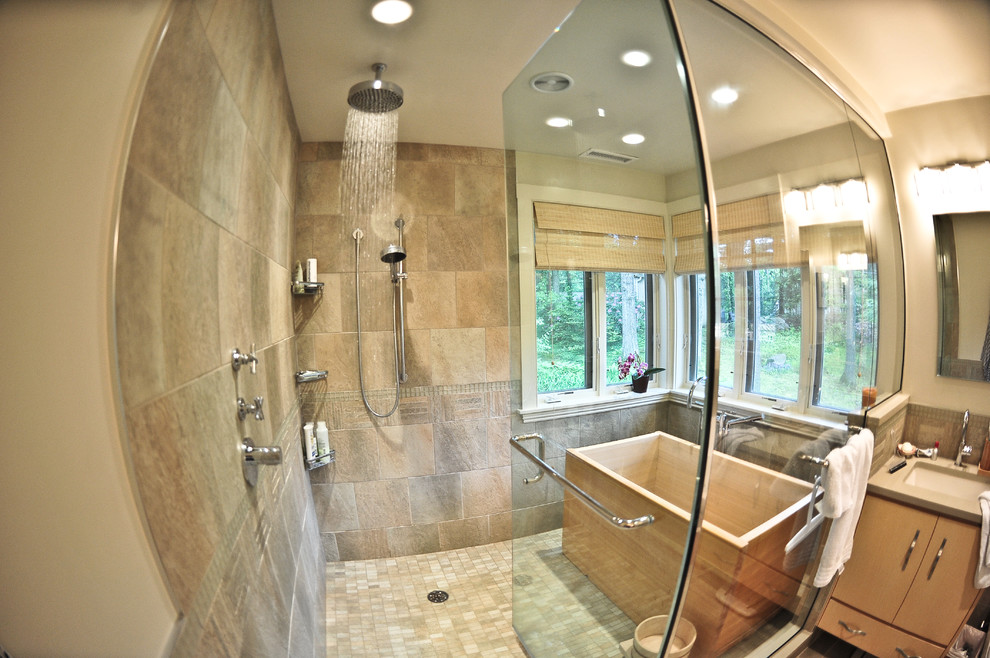 Photo of an expansive contemporary ensuite bathroom in Boston with a double shower, multi-coloured tiles, a submerged sink, light wood cabinets, wooden worktops and stone tiles.