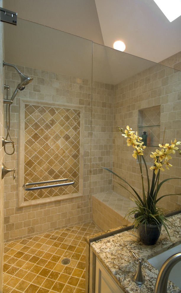 Photo of a large classic ensuite bathroom in Miami with beige tiles, an alcove bath, an alcove shower, porcelain tiles, beige walls, granite worktops, beige floors, a hinged door, raised-panel cabinets, white cabinets and a submerged sink.