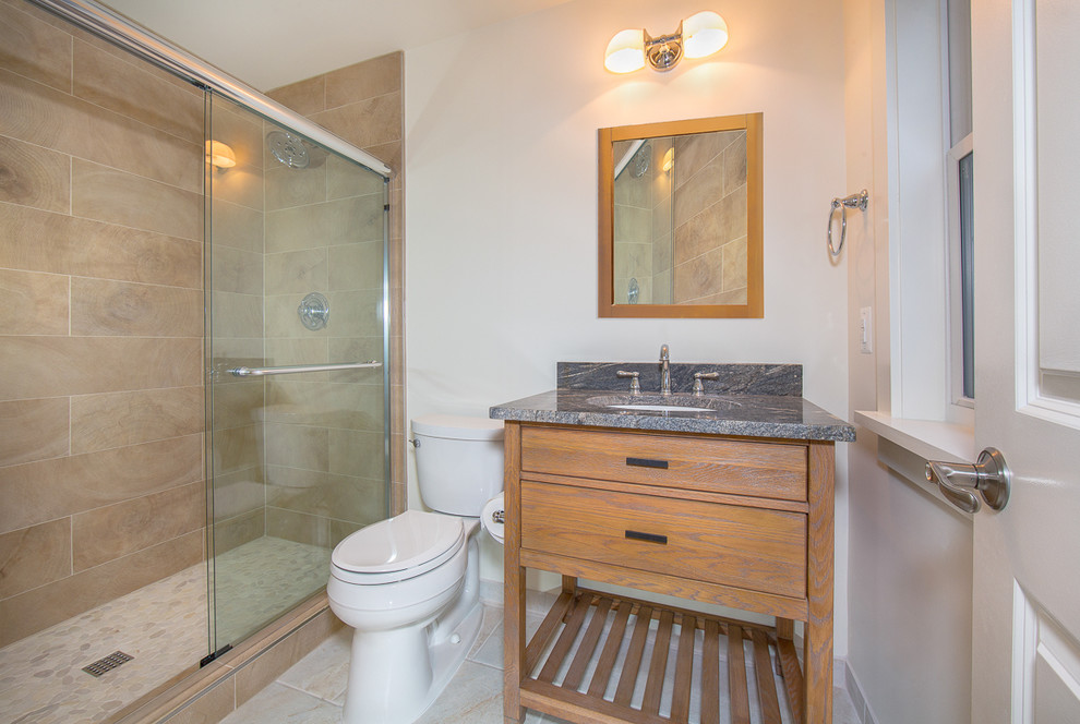 Small eclectic 3/4 brown tile and porcelain tile porcelain tile alcove shower photo in DC Metro with an undermount sink, furniture-like cabinets, medium tone wood cabinets, granite countertops, a two-piece toilet and beige walls