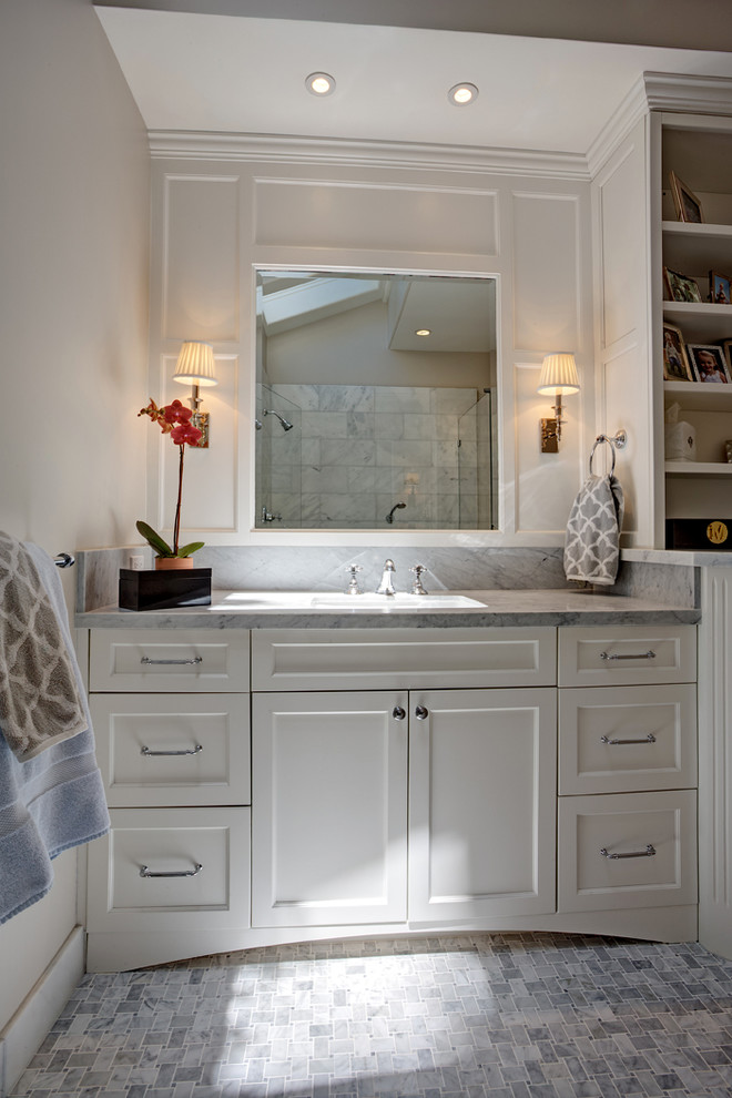 Example of a large transitional master white tile and stone tile mosaic tile floor bathroom design in San Francisco with an undermount sink, recessed-panel cabinets, white cabinets, marble countertops, a two-piece toilet and beige walls