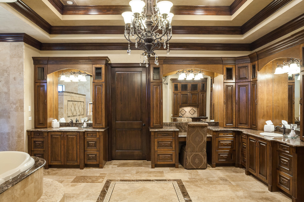 Inspiration for an expansive traditional ensuite bathroom in Houston with a built-in sink, raised-panel cabinets, medium wood cabinets, marble worktops, a built-in bath, a walk-in shower, a two-piece toilet, beige tiles, stone tiles, beige walls and travertine flooring.
