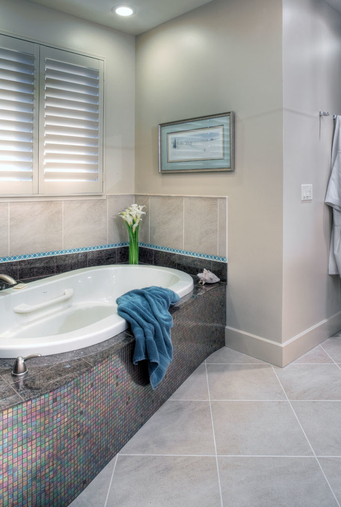 Example of a mid-sized trendy master beige tile, blue tile and porcelain tile porcelain tile and gray floor bathroom design in Omaha with beaded inset cabinets, light wood cabinets, a two-piece toilet, gray walls, an undermount sink and granite countertops