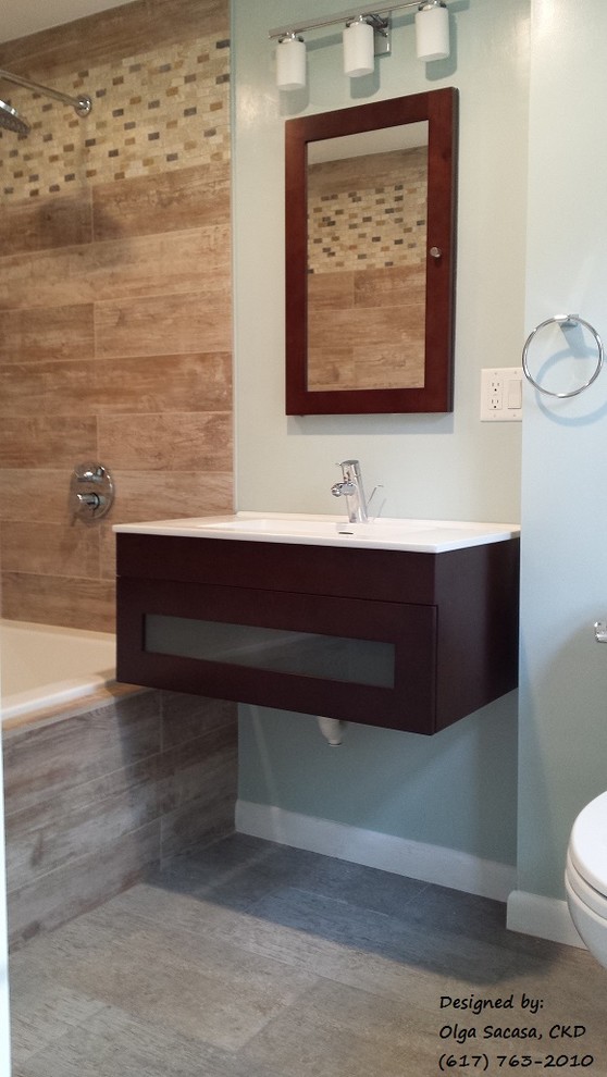 Mid-sized trendy master porcelain tile and brown tile porcelain tile bathroom photo in Boston with a wall-mount sink, flat-panel cabinets, dark wood cabinets, a two-piece toilet and blue walls