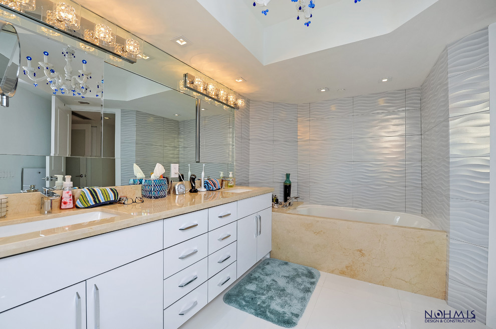 Inspiration för ett mellanstort funkis en-suite badrum, med möbel-liknande, vita skåp, ett hörnbadkar, en dusch/badkar-kombination, en toalettstol med separat cisternkåpa, vit kakel, keramikplattor, vita väggar, klinkergolv i porslin, ett piedestal handfat och granitbänkskiva