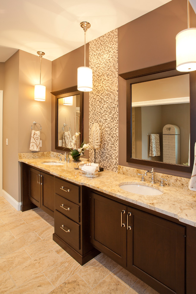 Photo of a traditional bathroom in Cincinnati with a submerged sink, flat-panel cabinets, brown cabinets, granite worktops, beige tiles, ceramic tiles, beige walls and ceramic flooring.