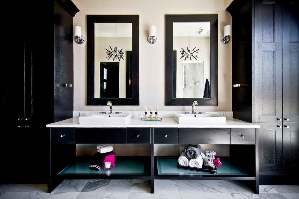 Photo of a contemporary ensuite bathroom in Austin with a vessel sink, recessed-panel cabinets, black cabinets and beige walls.