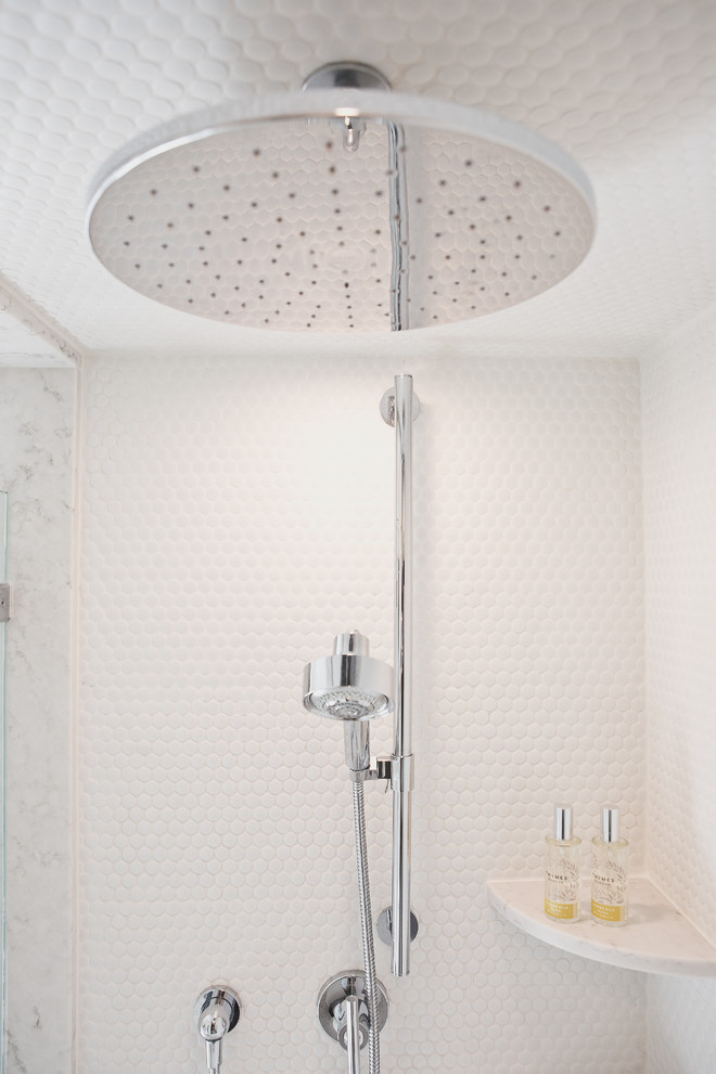 Small beach style master white tile and marble tile cement tile floor and gray floor bathroom photo in New York with raised-panel cabinets, white cabinets, a one-piece toilet, white walls, an undermount sink, marble countertops and a hinged shower door