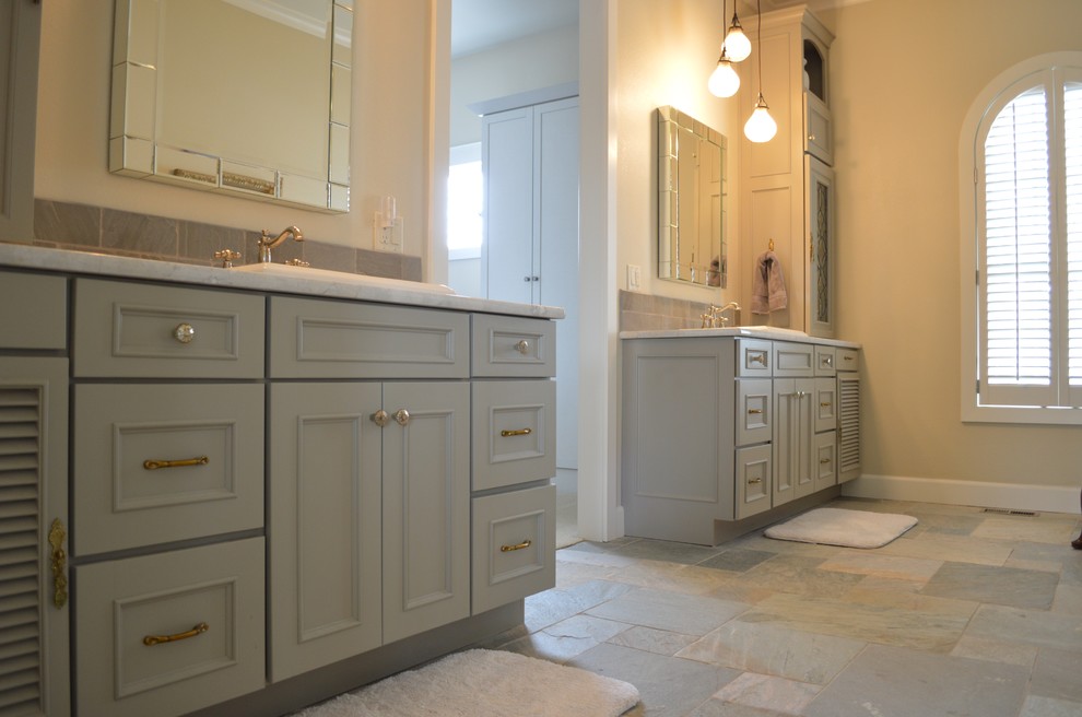 This is an example of a medium sized classic ensuite bathroom in Denver with louvered cabinets and grey cabinets.