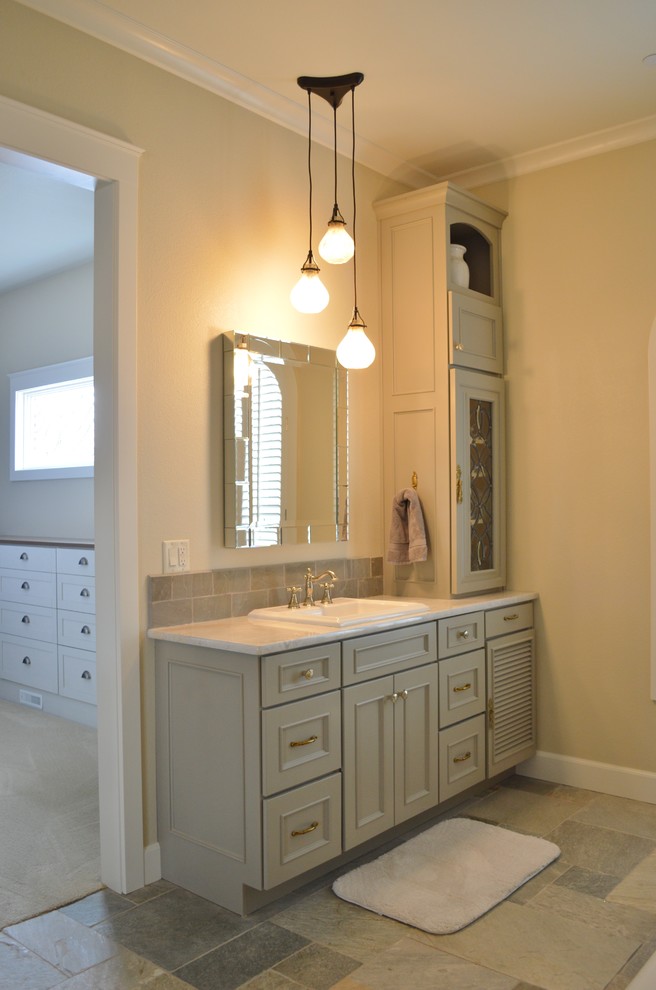 Photo of a medium sized classic ensuite bathroom in Denver with louvered cabinets and grey cabinets.