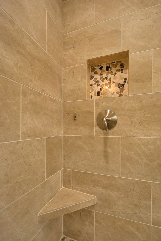 Alcove shower - mid-sized traditional master beige tile and porcelain tile porcelain tile and beige floor alcove shower idea in Phoenix with beige walls, a hinged shower door, raised-panel cabinets, dark wood cabinets, a two-piece toilet, an undermount sink and quartz countertops