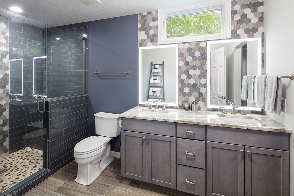 Inspiration for a large transitional master brown tile and ceramic tile brown floor doorless shower remodel in Other with a one-piece toilet, gray walls, granite countertops, a hinged shower door, gray countertops and an undermount sink