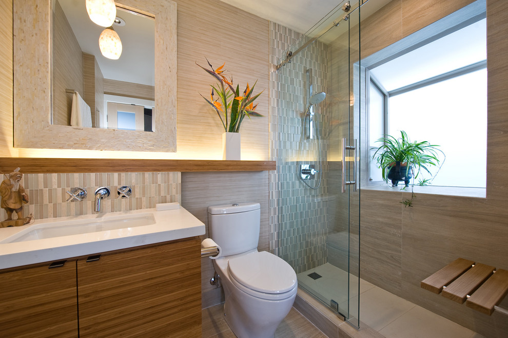 Photo of a medium sized contemporary shower room bathroom in Hawaii with flat-panel cabinets, brown cabinets, an alcove shower, a two-piece toilet, beige tiles, porcelain tiles, porcelain flooring, a submerged sink, beige floors, a sliding door and white worktops.