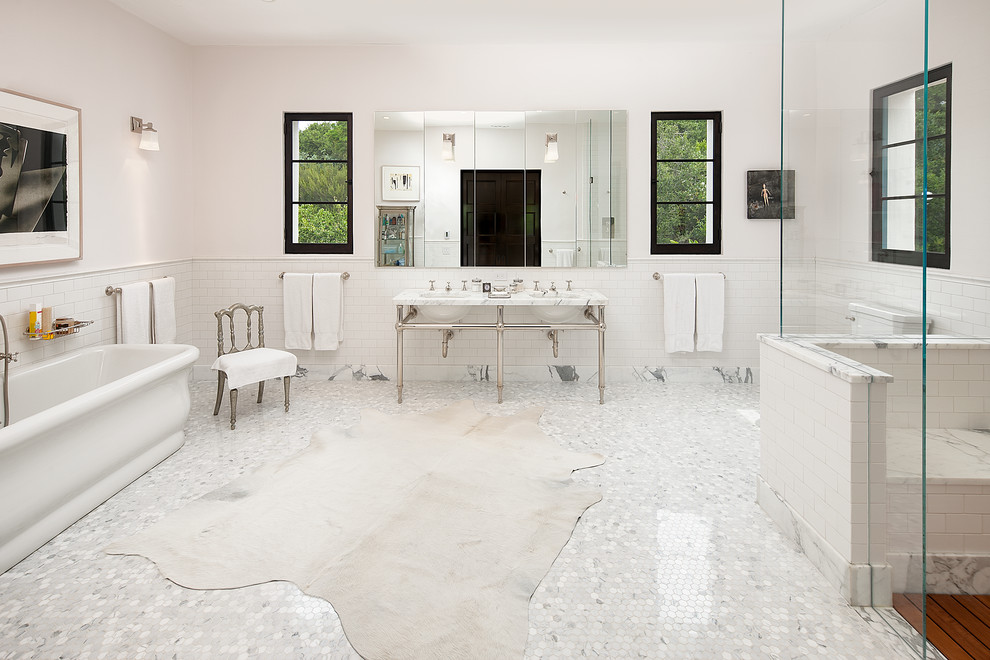 Huge transitional master white tile and subway tile marble floor bathroom photo in Santa Barbara with open cabinets, marble countertops, a two-piece toilet, white walls and a console sink