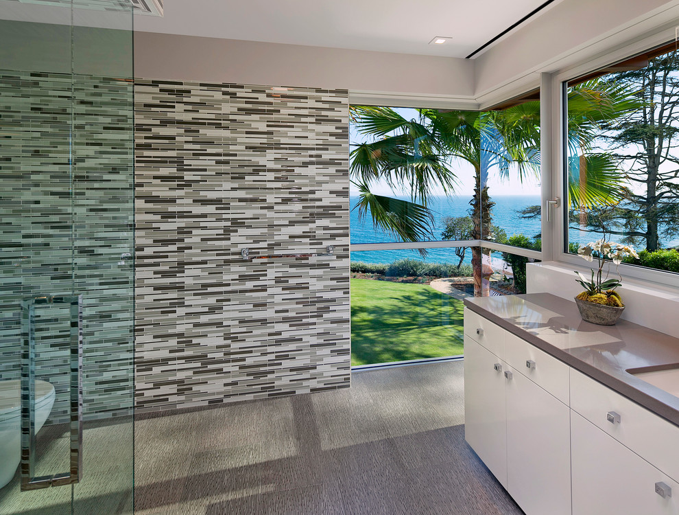 Alcove shower - modern 3/4 matchstick tile ceramic tile alcove shower idea in Santa Barbara with flat-panel cabinets, light wood cabinets, beige walls, an undermount sink and solid surface countertops