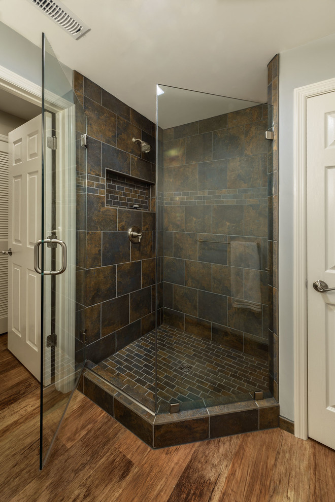 Inspiration for a medium sized classic shower room bathroom in Philadelphia with a corner shower, black tiles, multi-coloured tiles, stone tiles, grey walls and vinyl flooring.