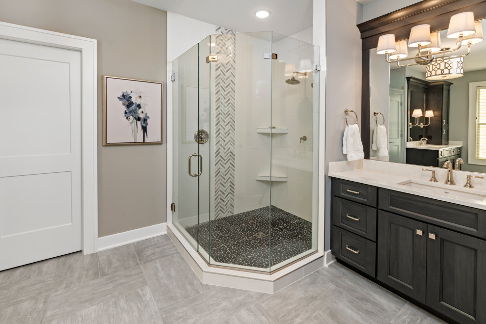 Inspiration for a medium sized traditional ensuite bathroom in Cincinnati with shaker cabinets, grey cabinets, a corner shower, black and white tiles, ceramic tiles, grey walls, ceramic flooring, a submerged sink, engineered stone worktops, grey floors, a hinged door and white worktops.