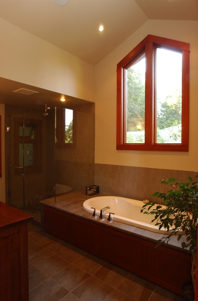 Large traditional ensuite bathroom in Vancouver with an alcove bath, a corner shower and beige walls.