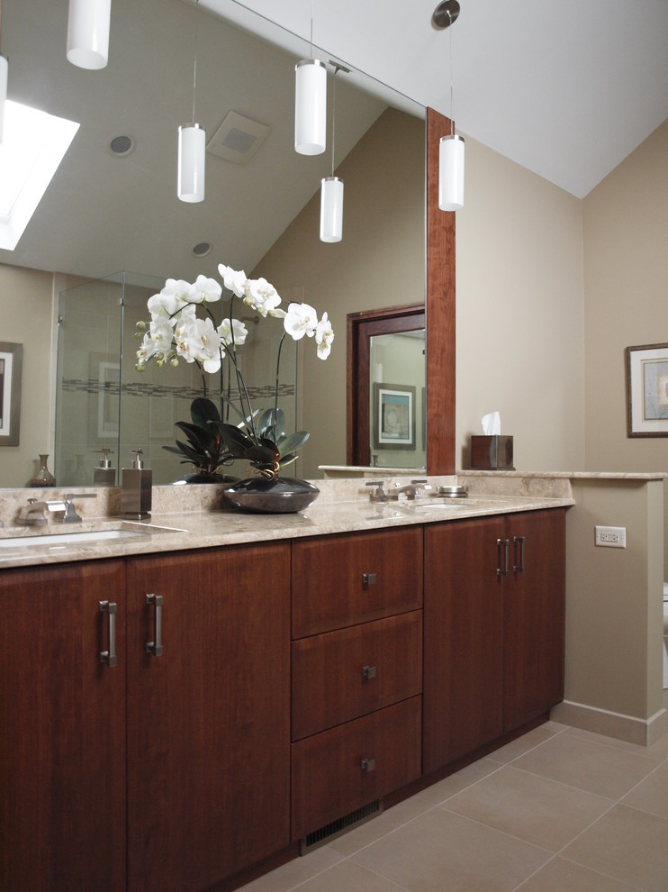 Example of a mid-sized trendy master beige tile bathroom design in Chicago with an undermount sink, flat-panel cabinets, dark wood cabinets and beige walls