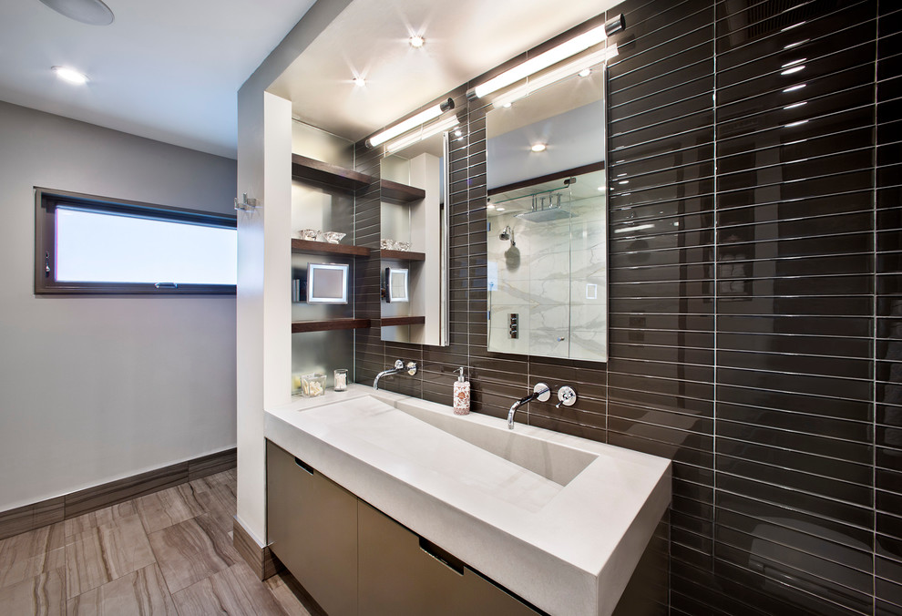 Medium sized contemporary ensuite bathroom in New York with flat-panel cabinets, beige cabinets, black tiles, glass tiles, white walls, porcelain flooring, an integrated sink and engineered stone worktops.