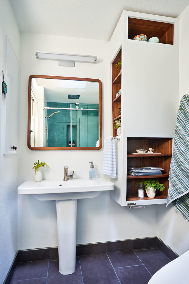 Bathroom - small contemporary master green tile and porcelain tile porcelain tile and gray floor bathroom idea in Portland with open cabinets, white walls, a pedestal sink and white cabinets