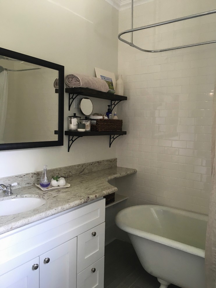 Example of a small eclectic master white tile and subway tile porcelain tile bathroom design in Houston with shaker cabinets, white cabinets, white walls, an undermount sink and granite countertops