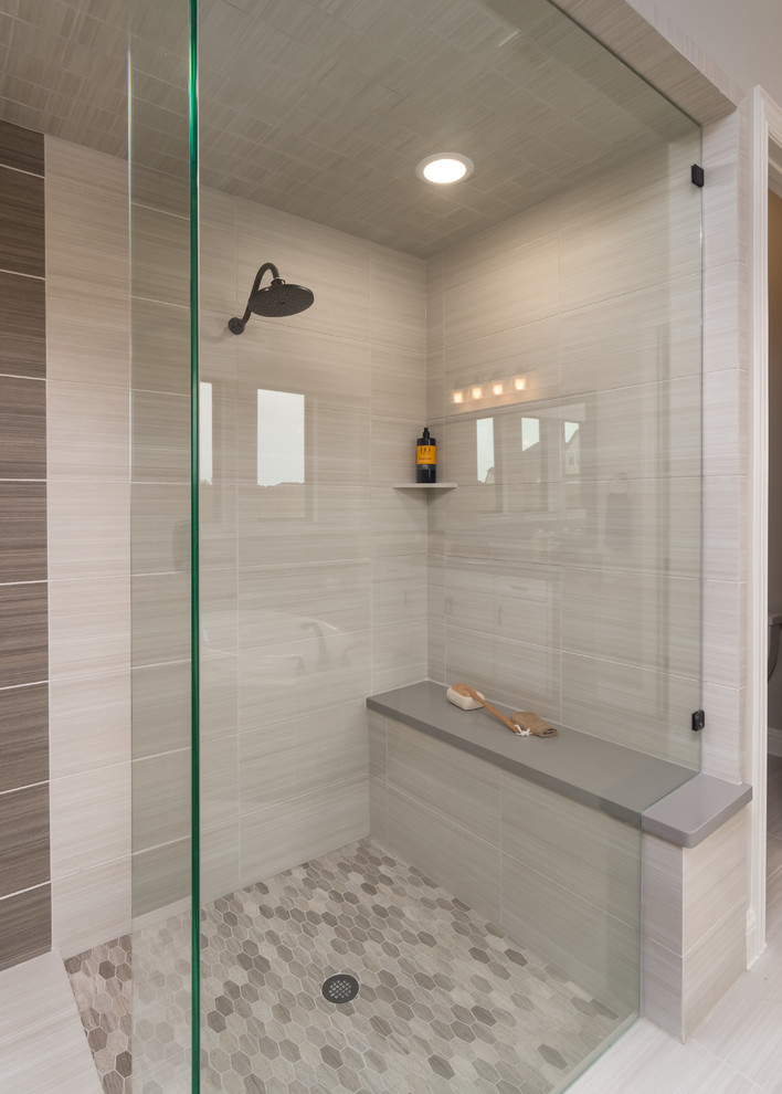 Large ensuite bathroom in Houston with recessed-panel cabinets, a built-in bath, a corner shower, beige tiles, ceramic tiles, grey walls, ceramic flooring, a submerged sink, solid surface worktops, beige floors, an open shower, grey worktops and white cabinets.