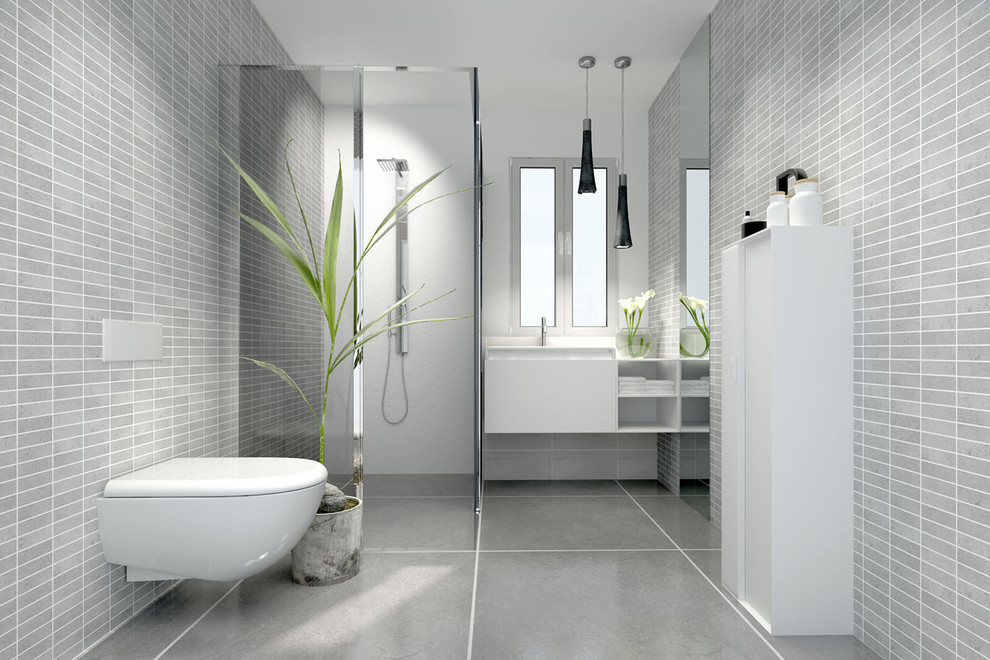 This is an example of a medium sized scandinavian shower room bathroom in Chicago with a corner shower, grey walls, a submerged sink, a hinged door, flat-panel cabinets, white cabinets, a wall mounted toilet, grey tiles, stone tiles, concrete flooring and grey floors.