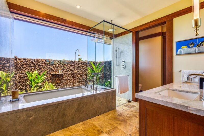 Inspiration for a mid-sized craftsman master multicolored tile and stone tile travertine floor corner shower remodel in Hawaii with shaker cabinets, medium tone wood cabinets, an undermount tub, a one-piece toilet, yellow walls, a vessel sink and granite countertops