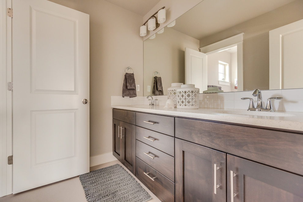 Large family bathroom in Boise with shaker cabinets, laminate worktops and grey walls.