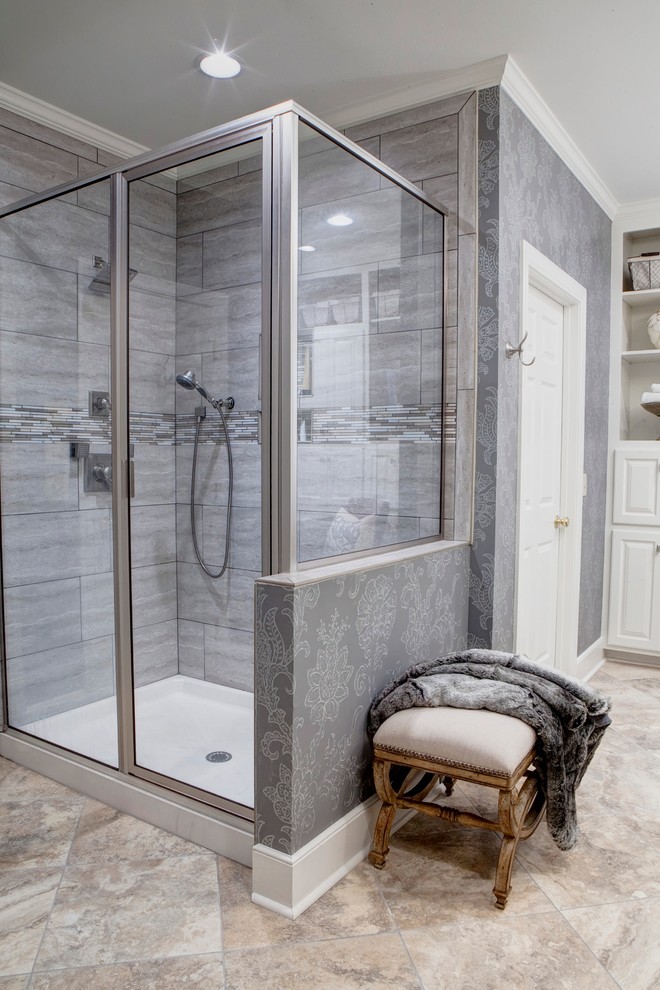 Photo of a large traditional ensuite bathroom in Charleston with a submerged sink, raised-panel cabinets, white cabinets, granite worktops, an alcove bath, an alcove shower, grey tiles, porcelain tiles, grey walls and travertine flooring.