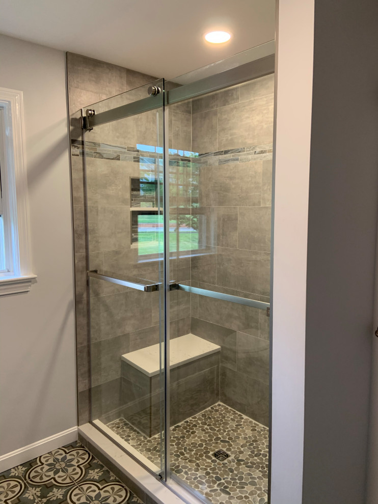 Mid-sized elegant master gray tile and porcelain tile porcelain tile, gray floor and single-sink bathroom photo in Boston with shaker cabinets, gray cabinets, a one-piece toilet, gray walls, an undermount sink, quartz countertops, white countertops, a niche and a built-in vanity
