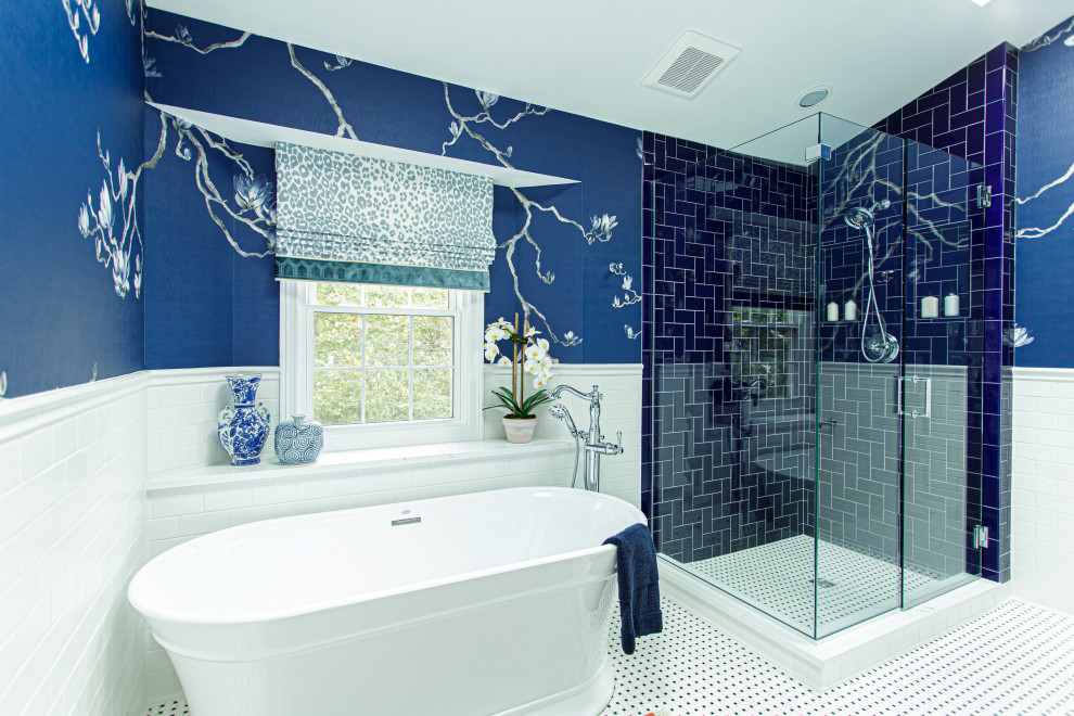 Inspiration for a medium sized traditional ensuite bathroom in Cleveland with a freestanding bath, a corner shower, white tiles, porcelain tiles, blue walls, porcelain flooring, white floors, a hinged door, a wall niche and wallpapered walls.