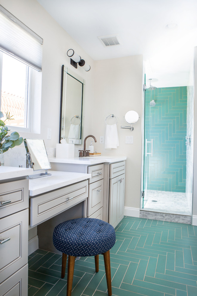 Photo of a large classic ensuite bathroom in Denver with raised-panel cabinets, grey cabinets, a freestanding bath, an alcove shower, a one-piece toilet, green tiles, ceramic tiles, white walls, ceramic flooring, a submerged sink, engineered stone worktops, green floors, a hinged door and white worktops.