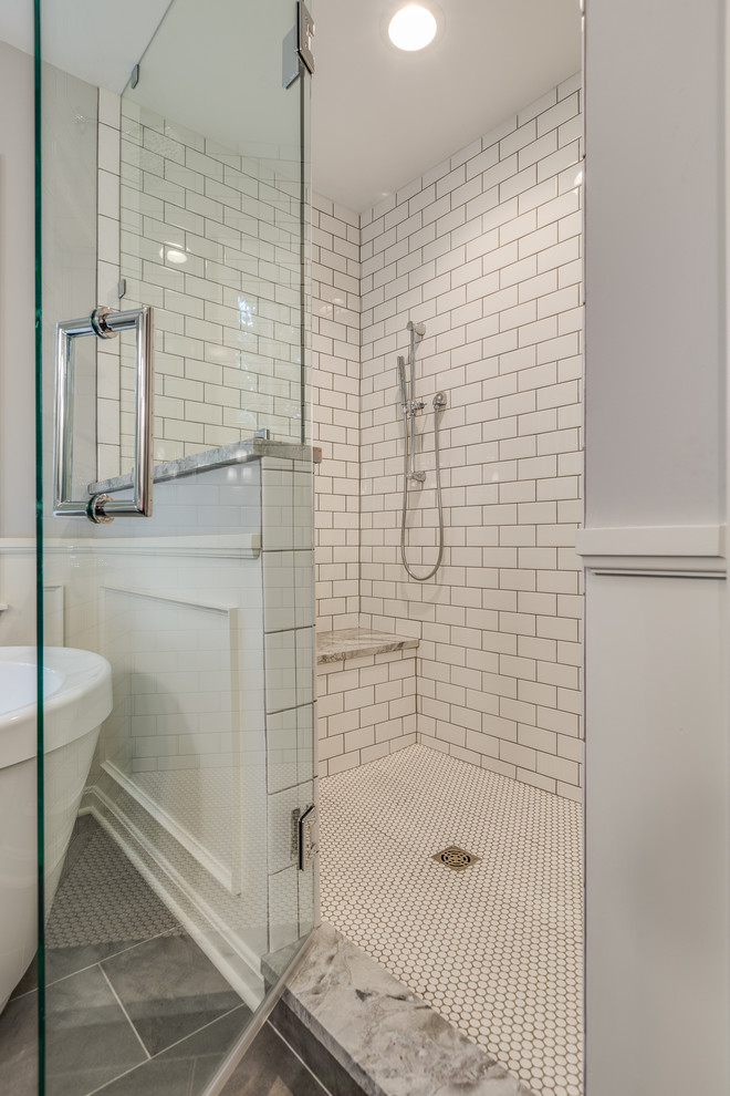 Example of a large farmhouse master porcelain tile and gray floor bathroom design in Cleveland with beaded inset cabinets, gray cabinets, gray walls, an undermount sink, granite countertops, a hinged shower door and multicolored countertops