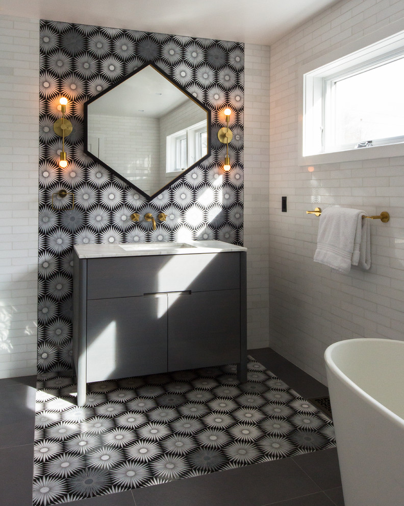 Freestanding bathtub - large eclectic multicolored tile and subway tile gray floor, porcelain tile and single-sink freestanding bathtub idea in New York with furniture-like cabinets, gray cabinets, an undermount sink, marble countertops, white countertops, white walls and a freestanding vanity