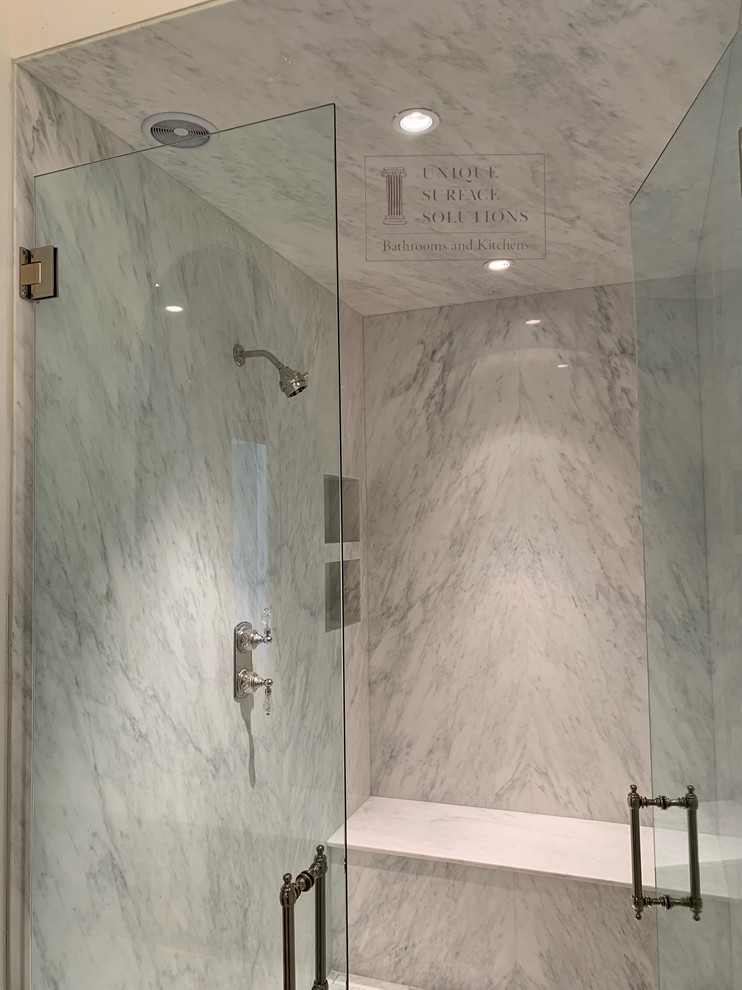 Medium sized contemporary ensuite bathroom in Atlanta with white tiles, stone slabs, white walls, a hinged door, marble flooring, white floors and an alcove shower.