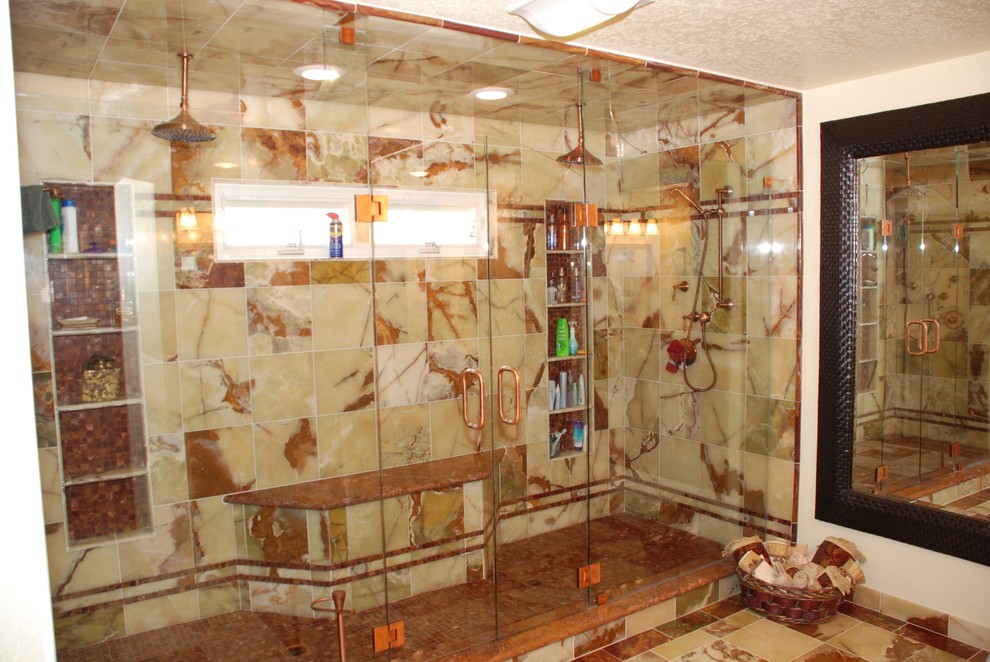 Alcove shower - huge mediterranean master green tile and stone tile marble floor alcove shower idea in Orange County with an undermount sink, raised-panel cabinets, distressed cabinets, a two-piece toilet and beige walls