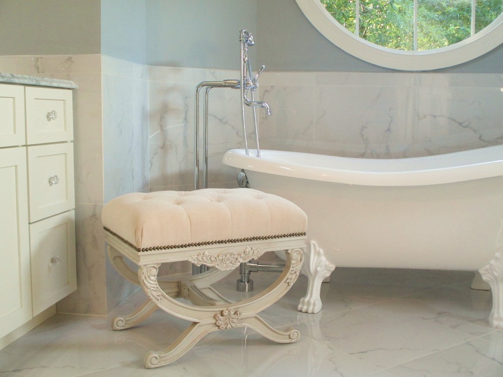 Photo of a traditional ensuite bathroom in Charlotte with white cabinets, marble worktops, a claw-foot bath, a corner shower, porcelain tiles, grey walls and porcelain flooring.