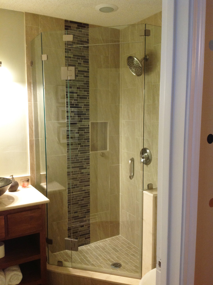 Example of a classic beige tile and ceramic tile corner shower design in Dallas with a vessel sink, flat-panel cabinets, medium tone wood cabinets and marble countertops