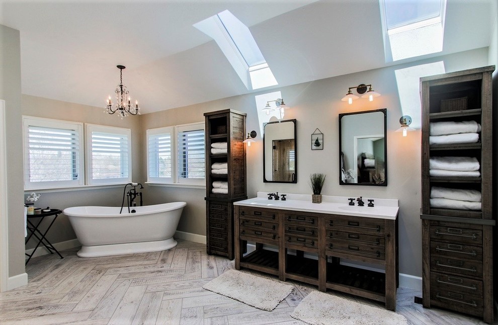 Inspiration for a mid-sized eclectic master ceramic tile and gray floor bathroom remodel in Denver with furniture-like cabinets, gray cabinets, gray walls, an integrated sink, quartzite countertops, a hinged shower door and white countertops